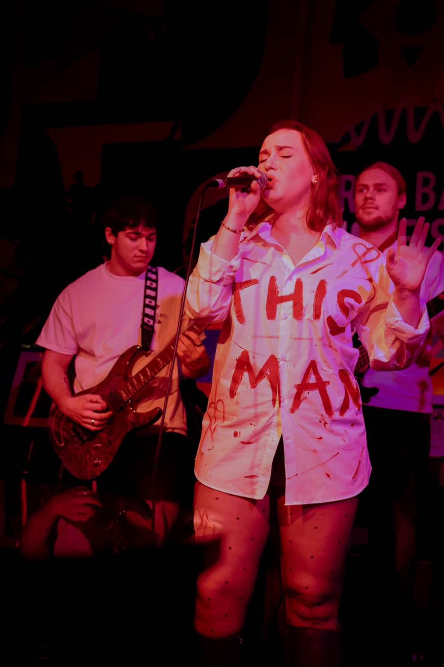 Fifi in her This Man shirt, singing with her band at the Arts Bar, Hope Street